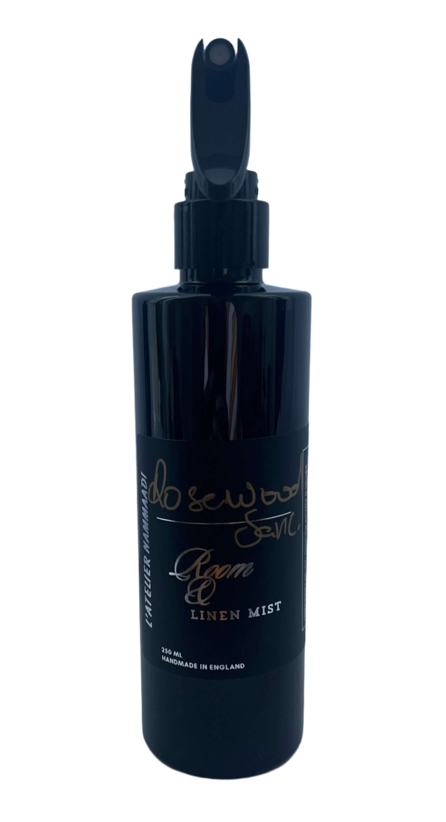 Rosewood & Leather Room & Linen Mist with warm rosewood, floral rose, geranium, clove, heliotrope, and a base of leather, tonka, and musk.