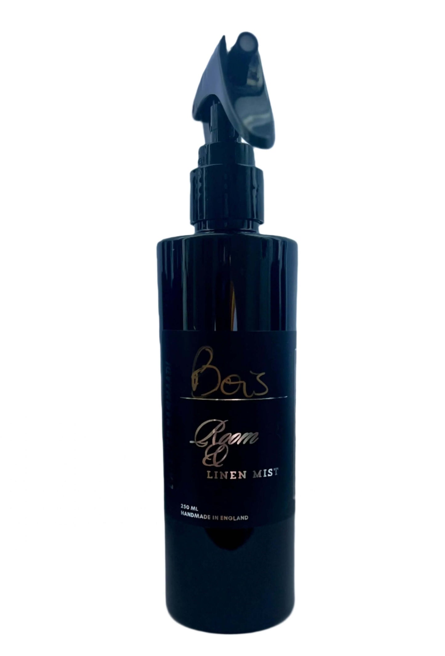 BOIS Room & Linen Mist with eucalyptus, saffron, cedarwood, violet, patchouli, sandalwood, vanilla, and musk. Sophisticated black bottle.